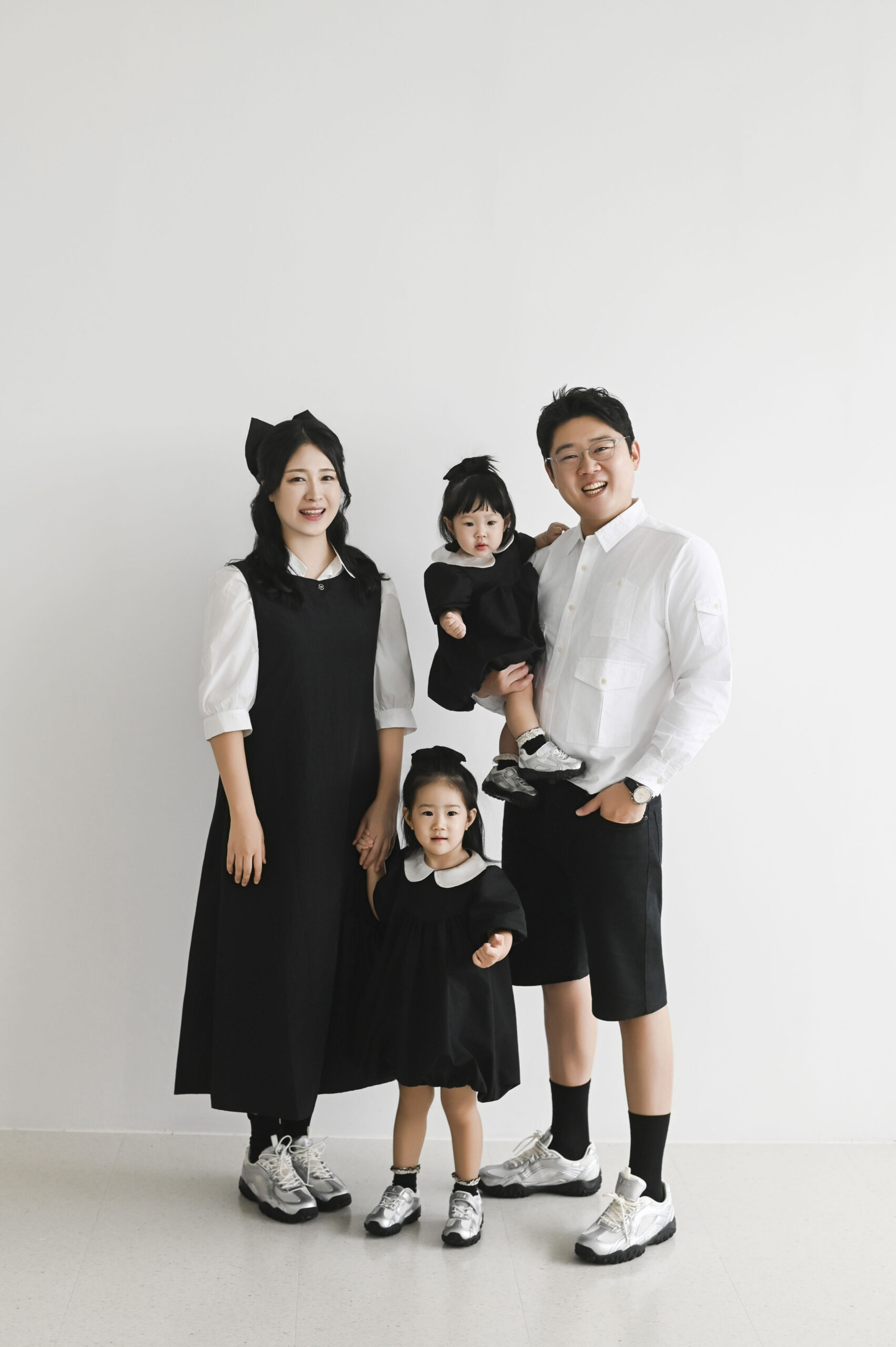JOA Mom with her children in a home kitchen, preparing baby food